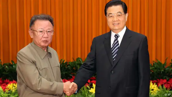 In this photo released by China's Xinhua News Agency on Friday, President Hu Jintao, right, meets with North Korean leader Kim Jong Il at the Great Hall of the People in Beijing