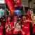 Supporters of National League for Democracy celebrate at party headquarters after the general election in Yangon