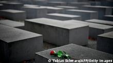 A lone red rose lies on one of the concrete steles of the Memorial to the Murdered Jews of Europe (Holocaust memorial) in Berlin on November 9, 2020, the 82nd anniversary of the Kristallnacht Nazi pogrom. (Photo by Tobias Schwarz / AFP) (Photo by TOBIAS SCHWARZ/AFP via Getty Images)