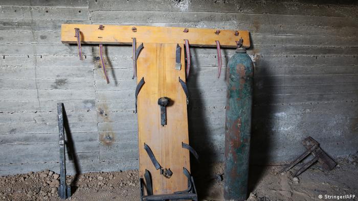 A general view shows material used for torture by Jaish al-Islam fighters in an underground prison in the formerly rebel-held Syrian town of Douma on the outskirts of Damascus