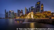This Friday, Aug. 21, 2020, picture provided by Yeen Ling Chong shows the Merlion statue with the background of business district in Singapore. (Yeen Ling Chong via AP) |