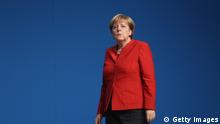 ESSEN, GERMANY - DECEMBER 06: German Chancellor and Chairwoman of the German Christian Democrats (CDU) Angela Merkel walks after she was re-elected with 89.5% of the vote, one of her worst results ever, by delegates as party chairwoman at the 29th federal congress of the CDU on December 6, 2016 in Essen, Germany. Approximately 1,000 CDU delegates are meeting to debate and vote on the party's course for next year following the recent announcement by Merkel that she will run for a fourth term as chancellor in federal elections scheduled for next September. (Photo by Sean Gallup/Getty Images)