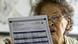 An elderly woman reviews her ballot at a voting center in San Juan, east of Manila An elderly woman reviews her ballot at a voting center in San Juan, east of Manila