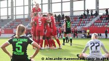 MUNICH, GERMANY - NOVEMBER 15: The team of Bayern München celebrate the opening goal whilst Leno Oberdorf (L) of Wolfsburg and her keeper Katarzyna Kiedrzynek look dejected during the Flyeralarm Frauen Bundesliga match between FC Bayern Women and VfL Wolfsburg Women at FC Bayern Campus on November 15, 2020 in Munich, Germany. (Photo by Alexander Hassenstein/Getty Images)