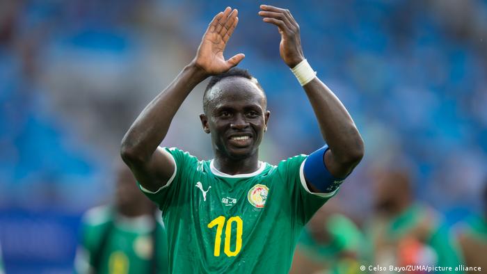 Sadio Mané applauds fans while in action for Senegal