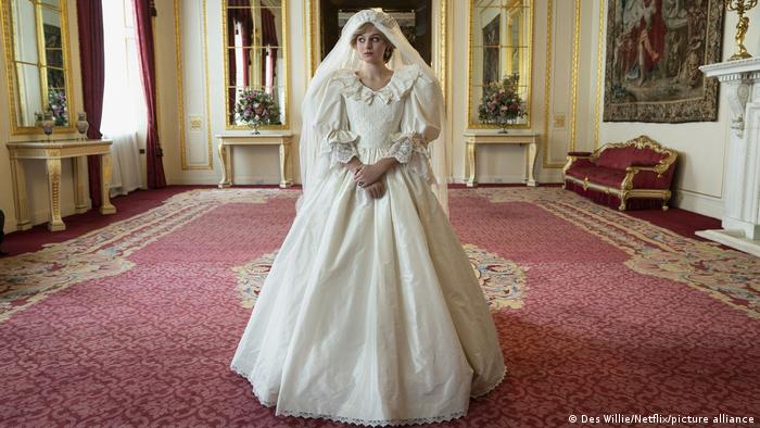 Emma Corrin in a wedding dress as Princess Diana in a scene from The Crown.