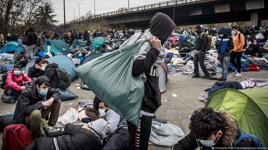 Migrants at the Saint Denis camp