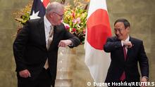 November 17, 2020***
Australian Prime Minister Scott Morrison greets Japan's Prime Minister Yoshihide Suga prior to the official welcome ceremony at Suga's official residence in Tokyo, Japan November 17, 2020. Eugene Hoshiko/Pool via REUTERS