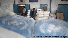 03.08.2015
Palestinian men rest at an aid distribution centre of the United Nations Relief and Works Agency (UNRWA) in Rafah in the southern Gaza Strip on August 3, 2015. AFP PHOTO / SAID KHATIB (Photo credit should read SAID KHATIB/AFP via Getty Images)
