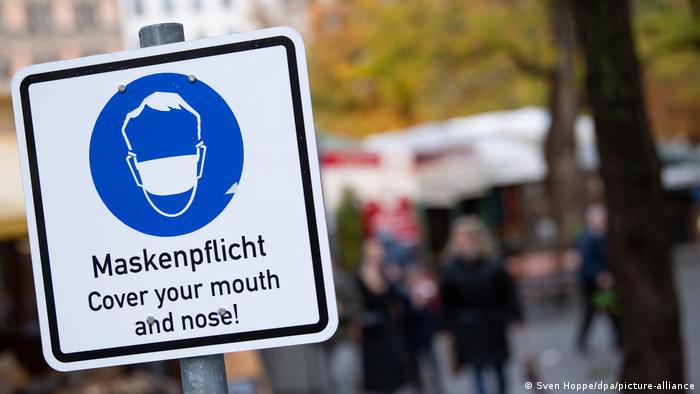 Sign in Munich warning people of their obligation to wear masks