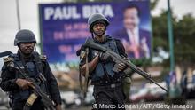 TOPSHOT - Members of the Cameroonian Gendarmerie patrols in the Omar Bongo Square of Cameroon's majority anglophone South West province capital Buea on October 3, 2018 during a political rally of the ruling CPDM party, Cameroon People's Democratic Movement of incumbent Cameroonian President Paul Biya. (Photo by MARCO LONGARI / AFP) (Photo credit should read MARCO LONGARI/AFP via Getty Images)