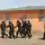 Des policiers anti-émeute béninois patrouillent à Cotonou