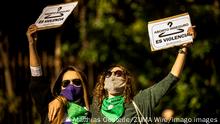 November 22, 2020, Barcelona, Catalonia, Spain: Transsexual women shout slogans raising a placard reading unsafe abortion is violence as she forms part of a human chain through Barcelona to mark the International Day for the Elimination of Violence against Women Barcelona Spain - ZUMAo105 20201122_zap_o105_021 Copyright: xMatthiasxOesterlex 