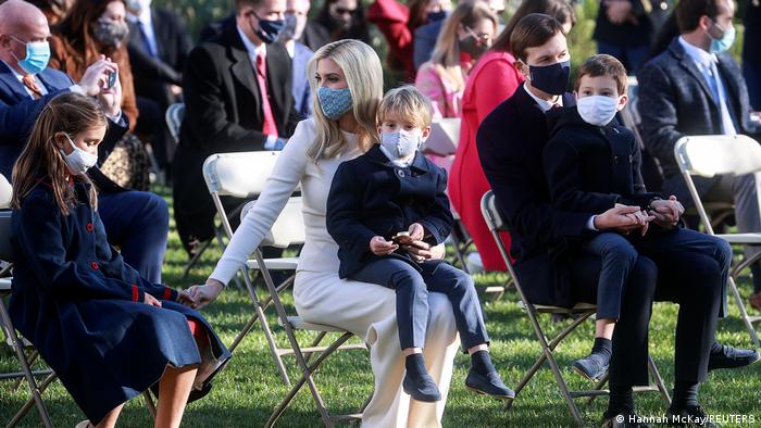 White House senior advisers Ivanka Trump and Jared Kushner sit with their children prior