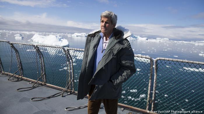 John Kerry standing in front of the Jakobshavn Glacier in Greenland