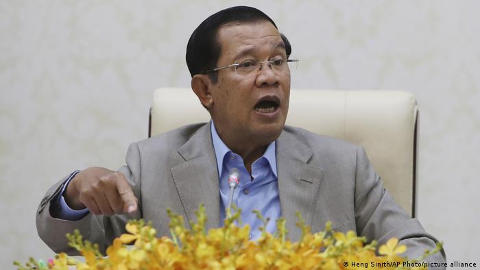 Prime Minister Hun Sen gestures during a speech on the current state of the coronavirus in Phnom Penh