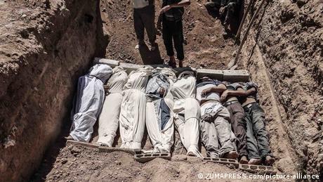 Bodies buried in a mass grave in Syria