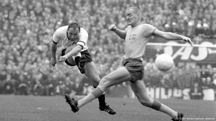 Uwe Seeler takes a shot on goal in 1965, black and white