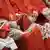 close up of the cardinals sitting, holding their biretta hats in their laps