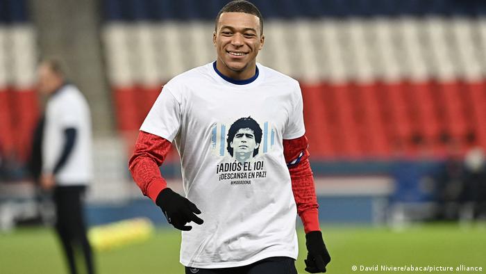 Paris Saint-Germain player Kylian Mbappe wears a T-shirt with Maradona's face
