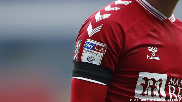 A player from Bristol City FC wearing a black armband during their game against Reading