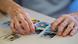 Hands of an Alzheimer's patient sorting through pictures Hands of an Alzheimer's patient sorting through pictures
