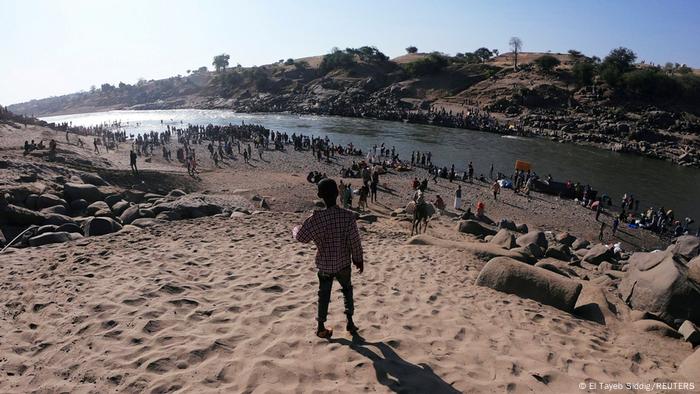 Ethiopians who fled Tigray at the Setit River on the Sudan-Ethiopian border