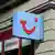 The TUI logo on a sign at a travel agency. Undated file photo.