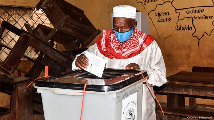 A man casting a ballot