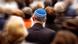 A man seen from behind wearing a blue-and-white yarmulke. The people around him are out of focus. Cologne, June 6, 2019. A man seen from behind wearing a blue-and-white yarmulke. The people around him are out of focus. Cologne, June 6, 2019.