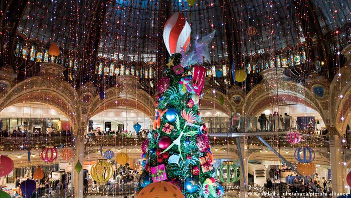 Giant Christmas fir tree in department store, Paris, France