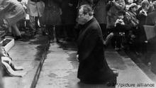 West Germany's Chancellor Willy Brandt kneels before the Jewish Heroes' monument in Warsaw, Poland, Monday, Dec. 6, 1970. Brandt is attending meetings to improve relations between his government and the Communist nations. (AP Photo)