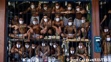 Gang members are seen inside a cell at Quezaltepeque jail during a media tour in Quezaltepeque, El Salvador, September 4, 2020. REUTERS/Jose Cabezas/File Photo TPX IMAGES OF THE DAY SEARCH GLOBAL COVID-19 FOR THIS STORY. SEARCH WIDER IMAGE FOR ALL STORIES.
