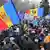 People attend a rally against legislation that would limit the powers of the newly elected pro-European president Maia Sandu in Chisinau