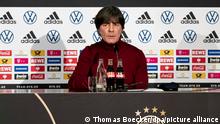 Fußball: DFB (Deutscher Fussball-Bund): Bundestrainer Joachim Löw sitzt in der DFB-Zentrale beim digitalen Pressegespräch auf dem Podium. Er will trotz der zuletzt enttäuschenden Spiele mit dem 0:6 in Spanien als Tiefpunkt nicht von seinem Weg mit der Nationalmannschaft abweichen.