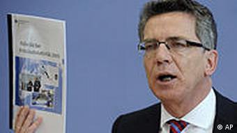 German Interior Minister Thomas de Maiziere presenting crime statistics last month