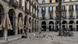 Two people sitting among pigeons on the Plaza Real in Barcelona Two people sitting among pigeons on the Plaza Real in Barcelona