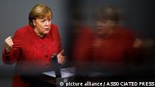 German Chancellor Angela Merkel delivers her speech during the debate about Germany's budget 2021, at the parliament Bundestag in Berlin, Germany, Wednesday, Dec. 9, 2020. (AP Photo/Markus Schreiber)