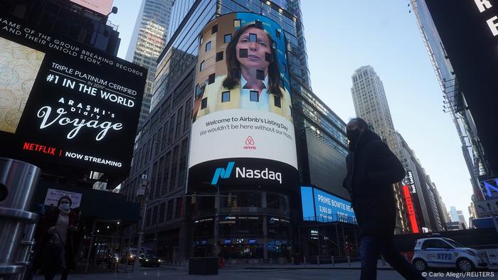 The NASDAQ market site displays an AirBnb sign on their billboard on the day of their IPO in Times Square in the Manhattan borough of New York