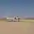 Heron TP drone on a sandy runway in Israel
