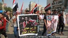 Iraqis hold photos of missing protesters during anti-government protest in Baghdad, Iraq, Sunday, Feb. 23, 2020. There are 25 activists still missing since the protests erupted on Oct. 1, 2019, according to the semi-official Iraqi High Commission for Human Rights. No group has claimed responsibility but activists have blamed the militias. (AP Photo/Khalid Mohammed) |