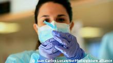 A nurse prepares to administer a flu vaccination at a temporary vaccination centre in Las Rozas, Madrid on 15th October, 2020. (Photo by Juan Carlos Lucas/NurPhoto)