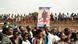 A group of people are seen holding up the poster of Faustin-Archange Touadera, President of the Central African Republic, during a campaign rally in the capital Bangui A group of people are seen holding up the poster of Faustin-Archange Touadera, President of the Central African Republic, during a campaign rally in the capital Bangui