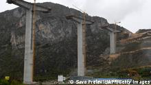 A picture taken on April 8, 2019, shows the bridge section of a highway connecting the city of Bar on Montenegros Adriatic coast to landlocked neighbour Serbia, (Bar-Boljare highway) near the village of Bioce, north of Montenegrin capital Podgorica, which is being constructed by China Road and Bridge Corporation (CRBC), the large state-owned Chinese company. - In the Serbian steel town of Smederevo, 54-year-old mill worker Zoran Matic thanks the Chinese -- or as we call them, our friends, for rescuing a factory that was on the brink of bankruptcy before China's HBIS group bought it in 2014 for 46 million euros ($52 million at current rates). From coal plants to airports, bridges and IT, China is forking out for investments across the Western Balkans, laying groundwork for a new battle for influence on the EU's fringe. (Photo by Savo PRELEVIC / AFP) (Photo credit should read SAVO PRELEVIC/AFP via Getty Images)