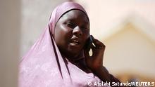 Murja Mohammed, whose son was abducted by gunmen at the Government Science school, speaks on her mobile phone in Kankara, in northwestern Katsina state, Nigeria December 13, 2020. REUTERS/Afolabi Sotunde
