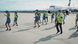 Flight crew recording a video for the Jerusalema challenge, dancing in a group in front of a plane on the tarmac at Riga Airport. Flight crew recording a video for the Jerusalema challenge, dancing in a group in front of a plane on the tarmac at Riga Airport.