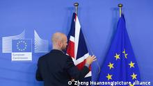 (191230) -- BEIJING, Dec. 30, 2019 () -- A staff member arranges flags of the UK and the EU before the meeting between President of the European Commission Jean-Claude Juncker and British Prime Minister Boris Johnson at the European Commission headquarters in Brussels, Belgium, Oct. 17, 2019. Protracted Brexit reveals institutional flaws of Western democracies On Oct. 28, the European Union accepted Britain's request for further delay of the Brexit date until Jan. 31, 2020, the third Brexit extension. Theresa May resigned as British prime minister after her Brexit deal was repeatedly rejected by the British Parliament. Boris Johnson, May's successor, pushed for an early general election on Dec. 12 to break the Brexit deadlock. The Conservative Party, led by Johnson, won an absolute majority in the House of Commons in the election, making the prospect of Brexit less remote. The bruising Brexit saga reveals that British society is severely divided, that the political decision-making procedure is impotent, and that Western democracy is plagued by institutional flaws and a governance crisis. (/Zheng Huansong)