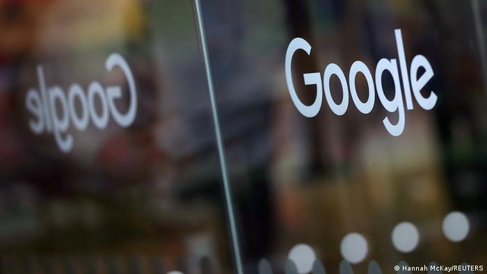 Google written on glass doors at its London offices