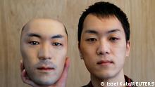Shuhei Okawara, 30, owner of mask shop Kamenya Omote, holds a super-realistic face mask based on his real face, made by using 3D printing technology, in Tokyo, Japan December 16, 2020. REUTERS/Issei Kato TPX IMAGES OF THE DAY