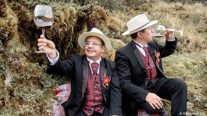Two men are drinking wine in Bolivia